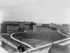 Campus View, 1924:  The Gymnasium (far right), first used in May of 1924, became the third building added to the new campus.  Note the Pines and the location of the street entrance to McComas Hall.  Also during this decade, Sam Holroyd Hall, the second dormitory for men, would later be acquired and completed in 1926 off-campus at the corner of Vermillion and Cooper Streets, near the vantage point of this view of campus.  (1924 Pine Tree)
